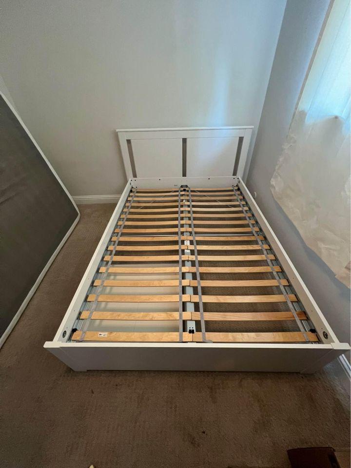 IKEA Full size Bed Frame and 4 Storage Drawers (Mattress NOT included).